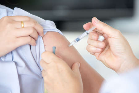 doctor make vaccinating to patient