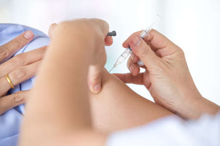 doctor makes vaccinating to patientの写真素材