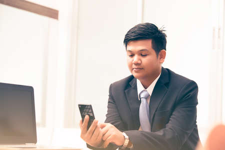 young business man using smart phone, business conceptの写真素材