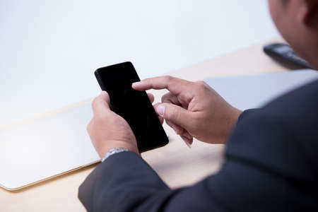 young business man using smart phone, business conceptの写真素材
