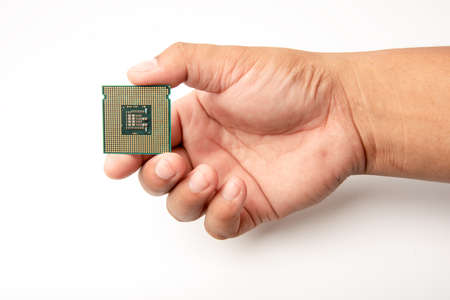 hand holding CPU on white backgroundの写真素材