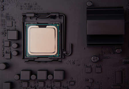 cpu installed on black motherboard, central processing unit on dark board