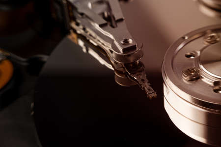 inside of hard disc or PC disc drive, close up or macro photography of hard drive show cylinder