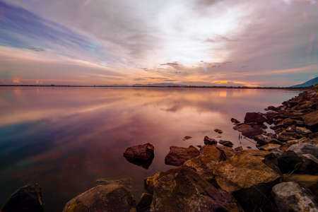 landscape sunset at dam in Thailand with full colorの写真素材