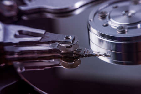 inside of hard disc or PC disc drive, close up or macro photography of hard drive show cylinder
