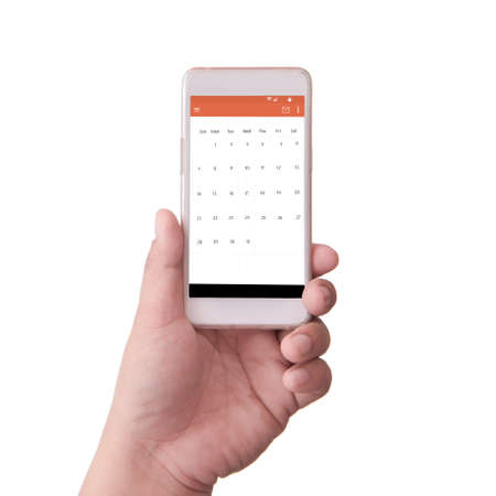 hand holding smart phone with scheduleの写真素材