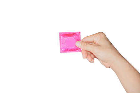hand holding pink condom isolated on white backgroundの写真素材