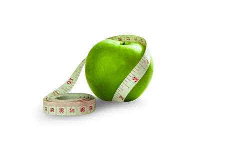 isolated green apple wrap around by measurment tapeの写真素材