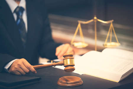 lawyer holding judge gavel in courtroom, lawyer judge concept