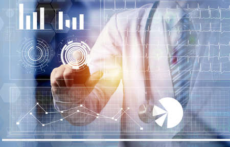 doctor touching on computer screen of futuristic technology screen, graph and illustration of patient vital sign, futuristic medical conceptの写真素材