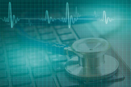 medical concept, double exposure of stethoscope on black keyboard and illustration ECG waveの写真素材