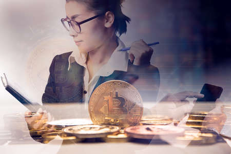 double exposure business woman holding chart with bit coin , bit coin and block chain concept