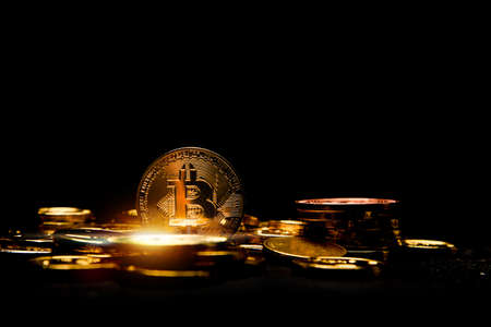 golden bitcoin on black background, digital money and cryptocurrency concept