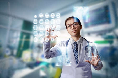woman doctor holding hand on touch screen, smart medical concept, doctor touching on x-ray hologram...