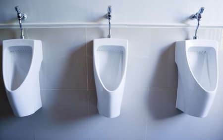 White urinals in the bathroom, modern toilet in hotelの写真素材