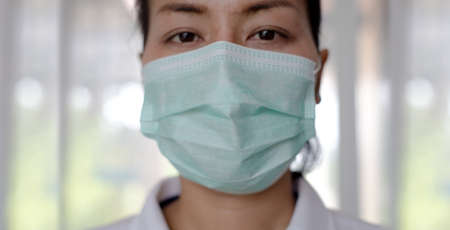 woman use surgical mask for prevent covid 19 infectionの写真素材