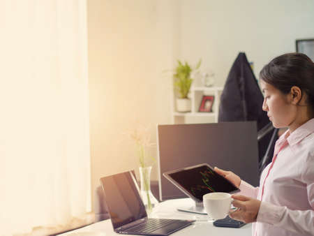 business woman trading forex stock, trading forex in tablet platform and destop