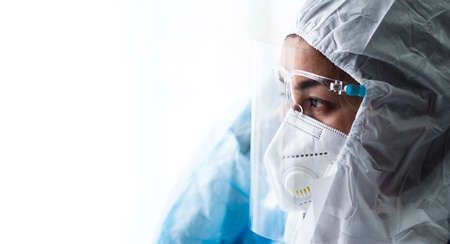 woman doctor in PPE (Personal Protective Equipment) for working in Covid19 ward and treatment hight...