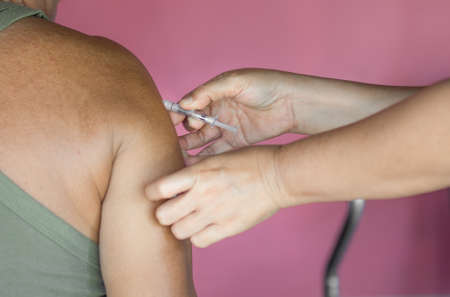 vacinating old man for prevent covid19 spreadの写真素材