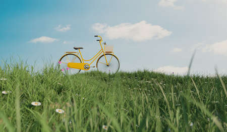 yellow bicycle at field grass hill, safe earth and environment protection concept, 3d illustration renderingの写真素材