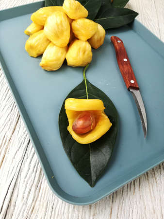 Homegrown Jack Fruits, cut to show seed and knife on the side