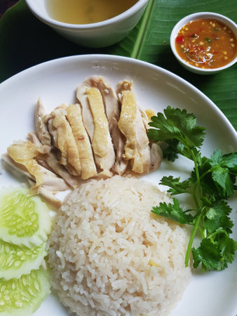 Hainanese chicken rice or steamed chicken rice with sauce and soupの写真素材