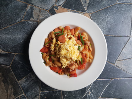 Home Cooking Macaroni Pasta with sausage, tomato and vegetables, ready to eatの写真素材