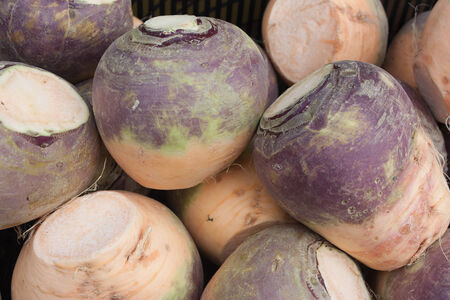 A box of swedes for sale, outside the greengrocers shop 