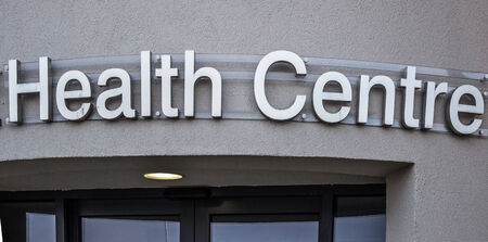 Health Centre Sign, over doorway of newly built health centreの写真素材