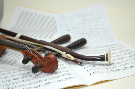 erhu and violin head with score backgroundの写真素材