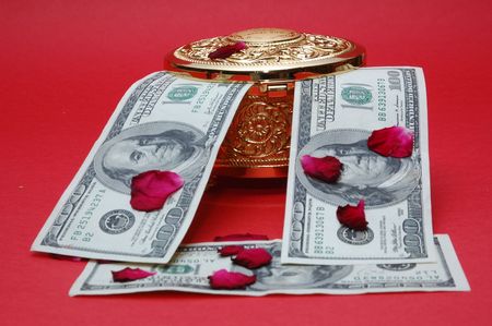 money with gold box and flower padsの写真素材