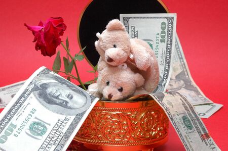 bear with gold box and flowerの写真素材