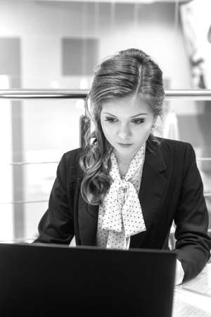 Young beautiful girl working on a laptopの写真素材