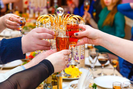 Clinking glasses with wineの写真素材