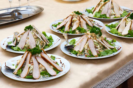 meat dishes on a table in a restaurantの写真素材