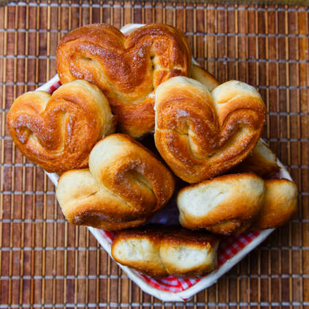 Fresh homemade buns on the bamboo tray, top view, square frame