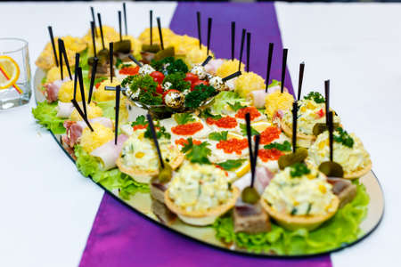 Appetizers with red caviar at the banquet tableの写真素材