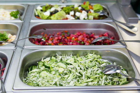 Salads in restaurant on the metal plates. selective focusの写真素材