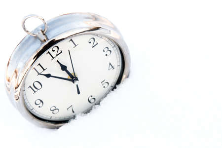 Retru watch in snow. New year greeting card, christmas concept.の写真素材