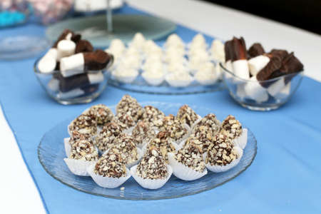 Small sweets on festive table in restaurantの写真素材