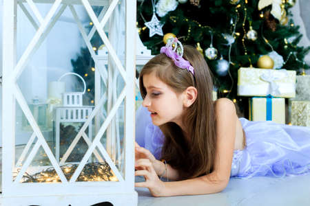 Pretty girl are in christmas decorated interiorの写真素材