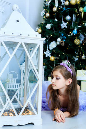 Pretty girl are in christmas decorated interiorの写真素材