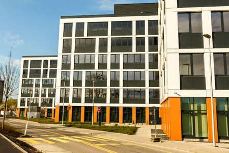 Exterior of new  apartment buildings in modern neighborhood. No people.  Real estate business...