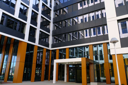 Entrance to modern office building  in a new contemporary business center, no people.