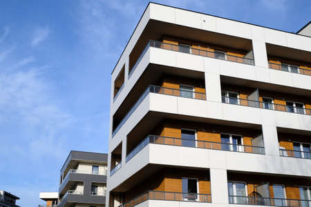 Facades of modern apartment buildings in contemporary residential district. No people.  Real estate...