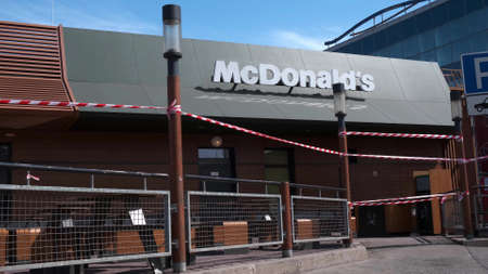 KRYVYI RIH, UKRAINE - APRIL, 2020. Building of McDonald's fast food restaurant surrounded by...