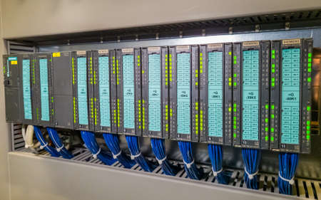 PLC modules in a row in electrical cabinet of automation control of industrial plant equipmentのeditorial素材