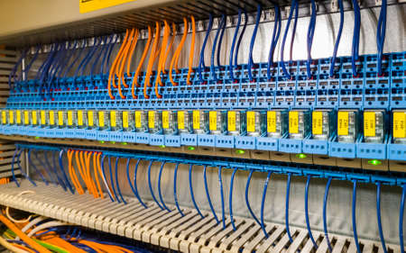 Group of magnet starters in a row in electrical cabinet of automation control industrial system