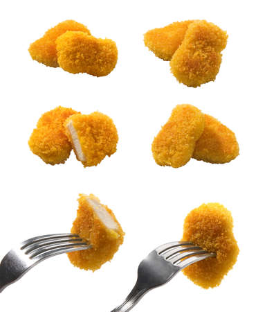 Some views of isolated fried chicken pieces on the white backgroundの写真素材