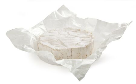 Whole camambert cheese in the white packageの写真素材